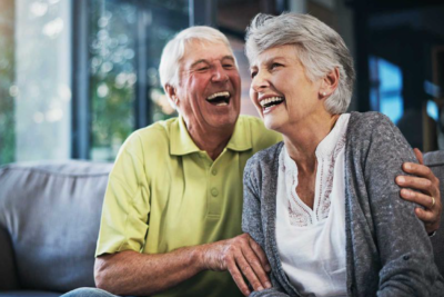 Image of a male and female senior laughing.