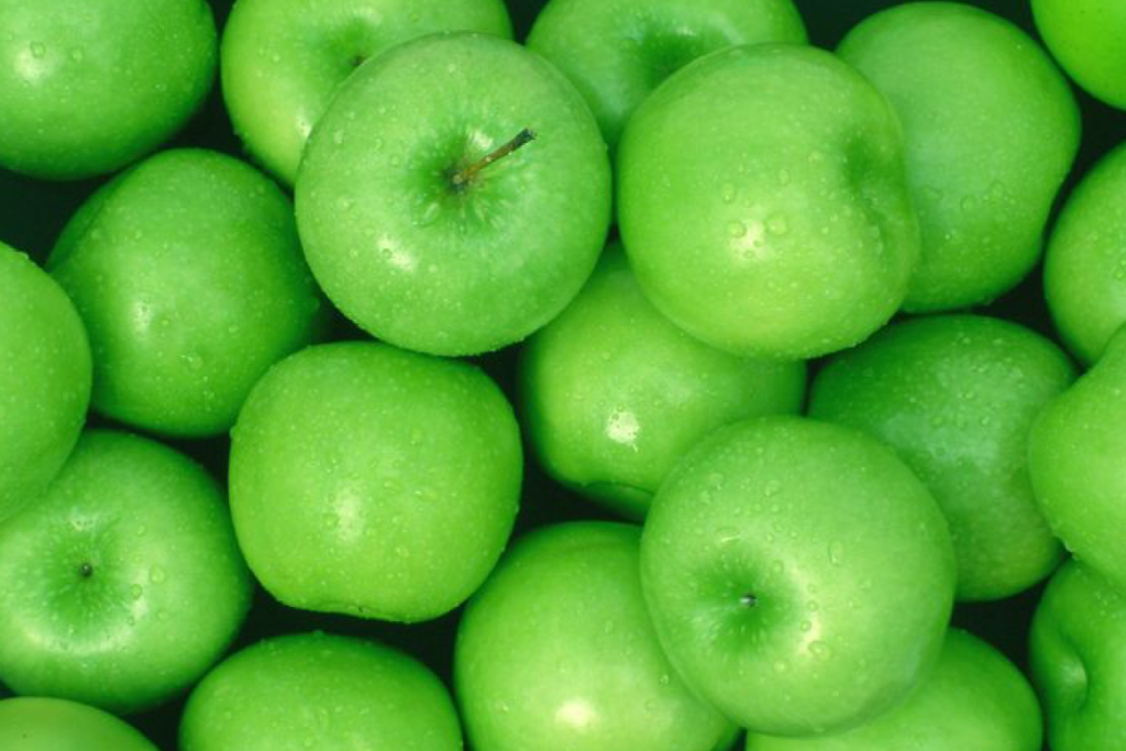 Image of a crate of green apples. A Tree Falls in the Forest: A Neuroscientist on the World Our Brain Creates