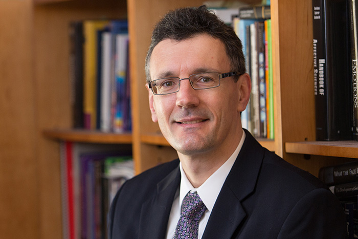 Headshot of Diego Pizzagalli, Ph.D in front of a bookcase