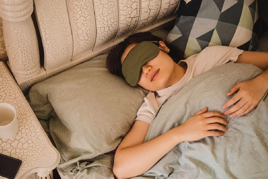 Image of person sleeping with eyemask on