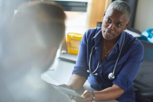 Concerned doctor speaking to patient